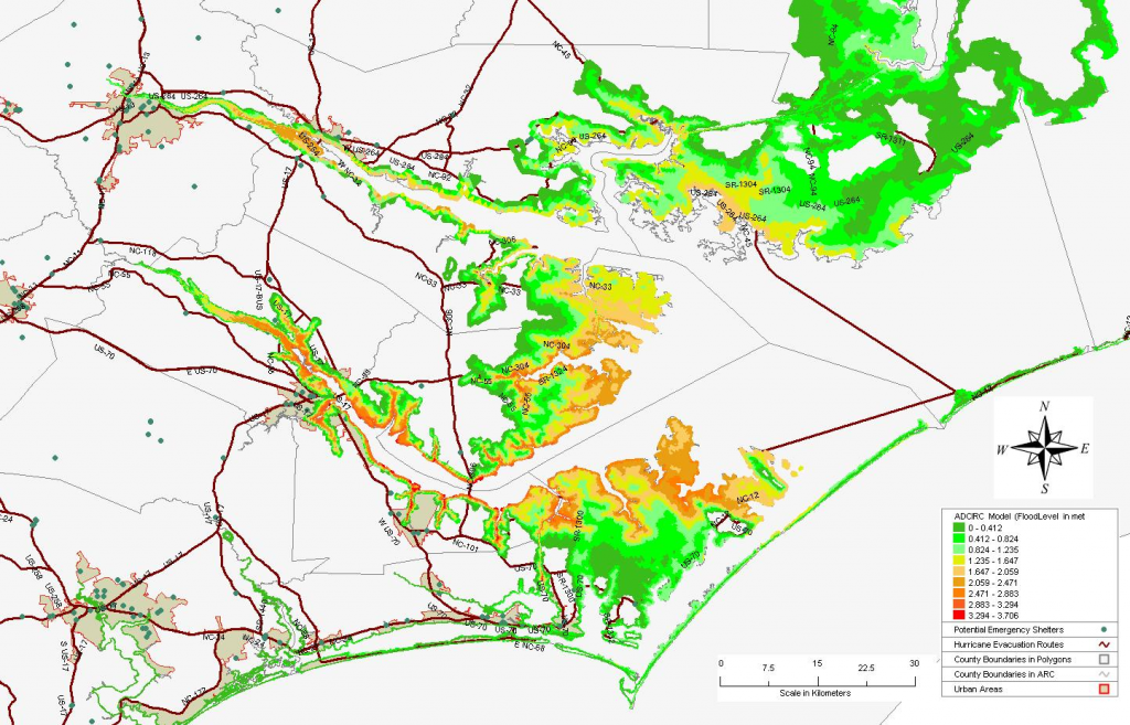 Storm surge inundation from Hurricane Isabel (2003) with evacuation routes and emergency management shelters (green dots).